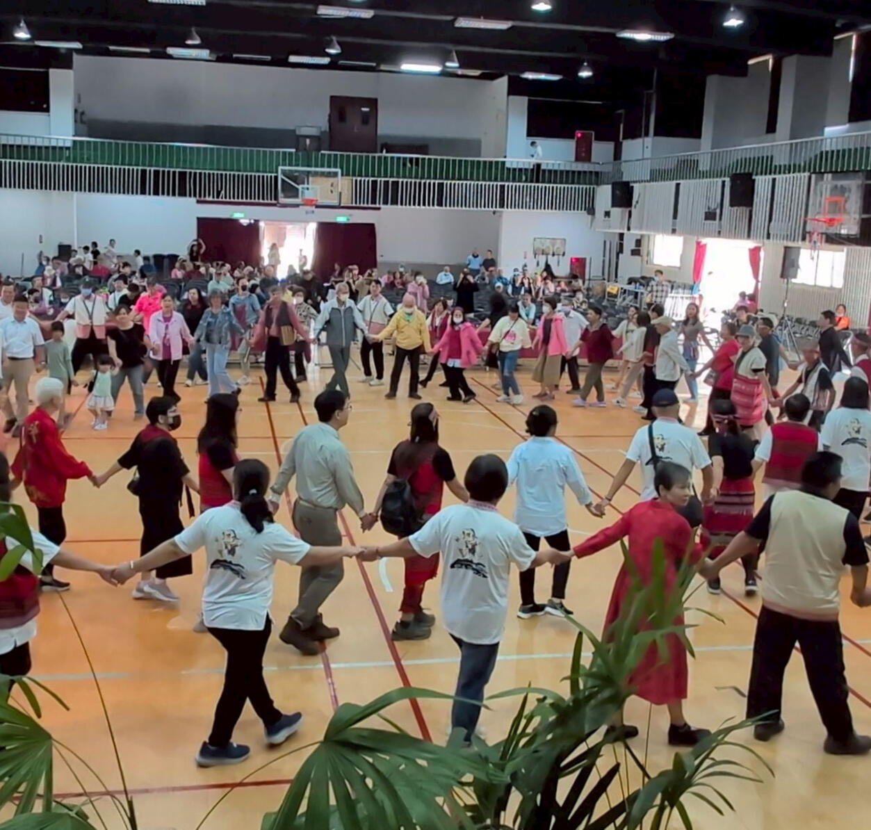 Photo by Ong Ek-kai Photo of people dancing in a circle singing Aiyan